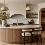 Soft modern kitchen with rounded island and arched range hood